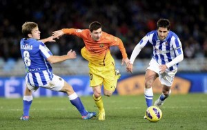 messi takes on two real sociedad players
